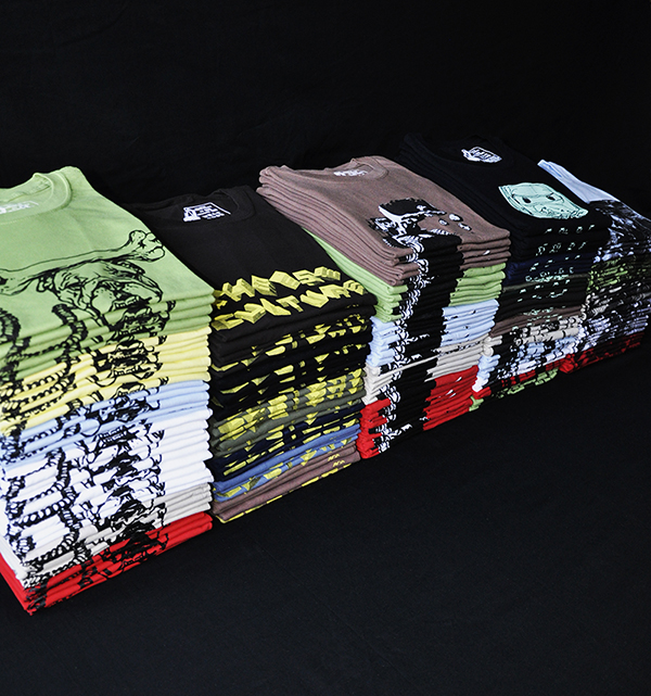 jorsh t-shirts folded and stacked showing different colours and designs